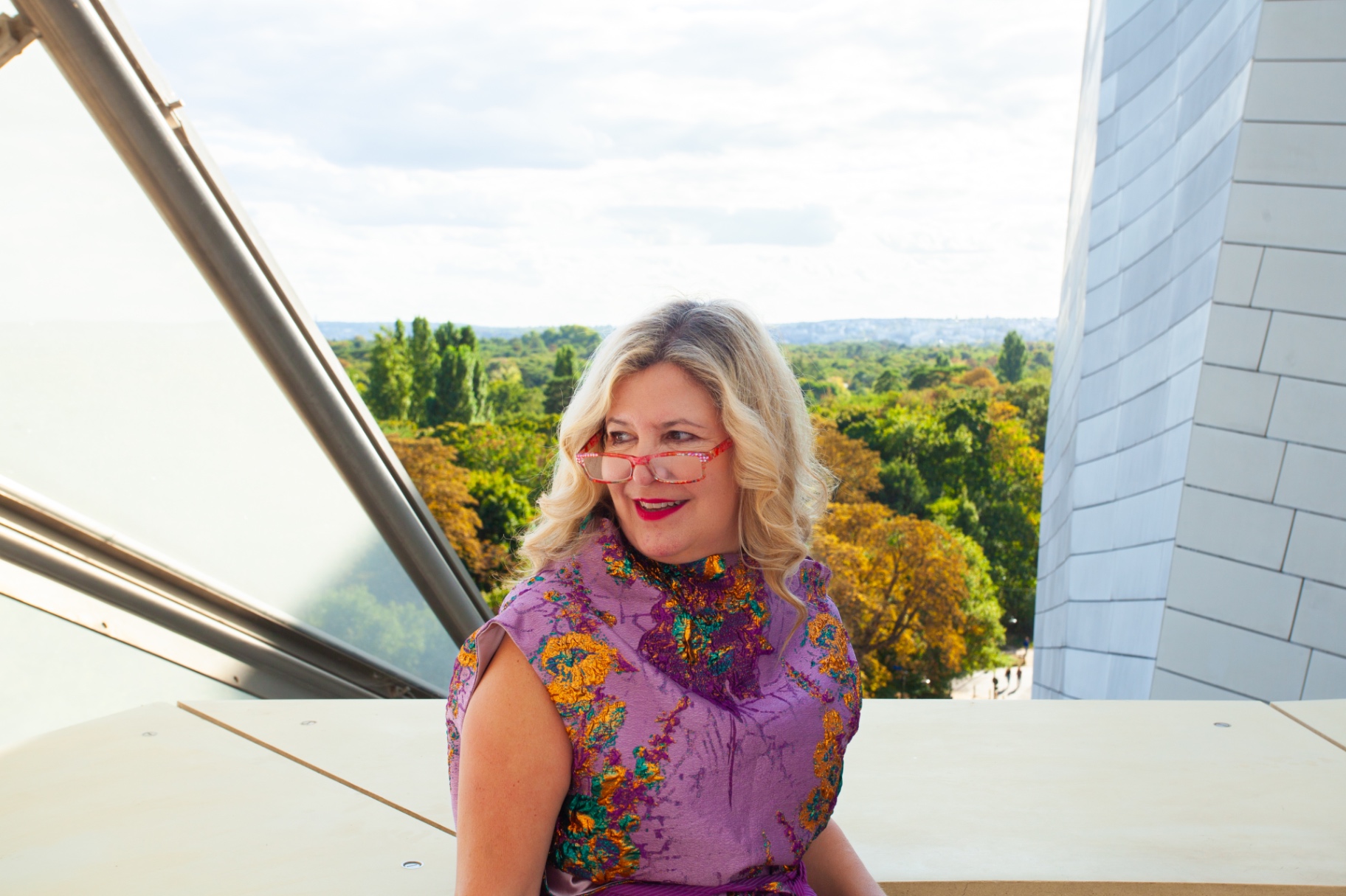 Sarah in a purple floral dress at the Fondation Louis Vuitton rooftop